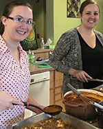 Two associates making dinner