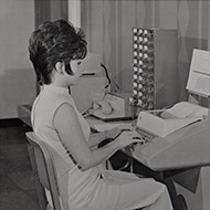 A woman at a computer station in 1960