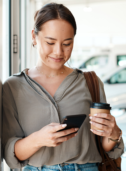 Person on phone using mobile functionalities.