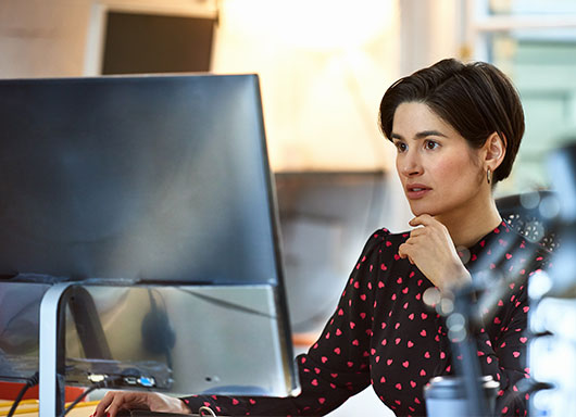 Woman making an electronic payment on her home computer