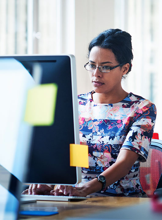 Woman making an electronic payment on her work computer