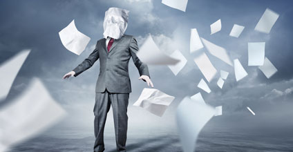 person surrounded by paper