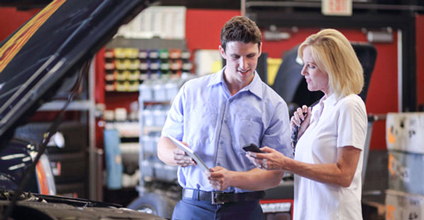 A tech and customer reviewing details during a service visit.