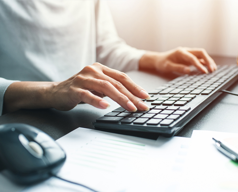 Image of woman typing on keyboard