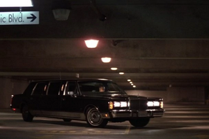 Limousine in a dark garage.