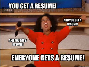 Oprah Winfrey in a red shirt giving out resumes