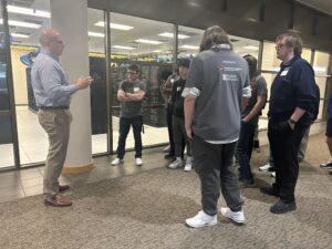 Clint C. talking with a group of students
