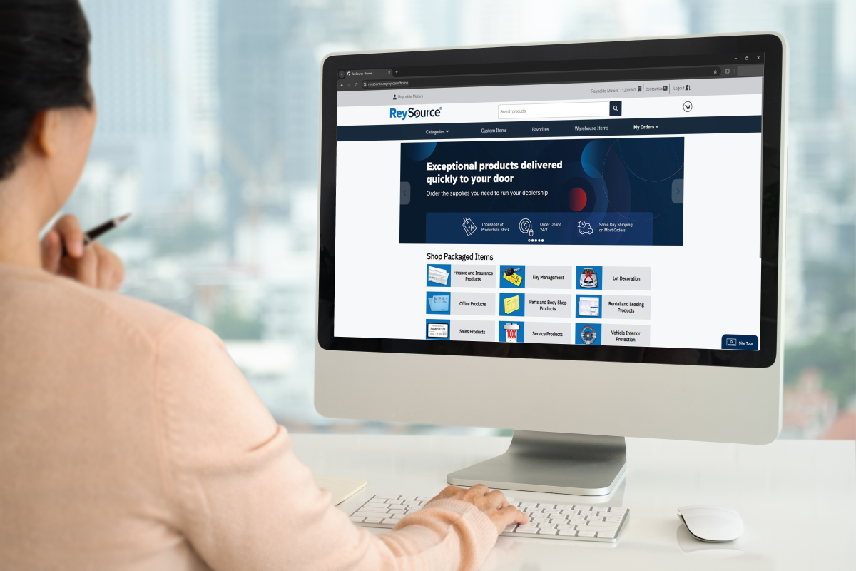 woman looking at reysource homepage on a desktop, reysource