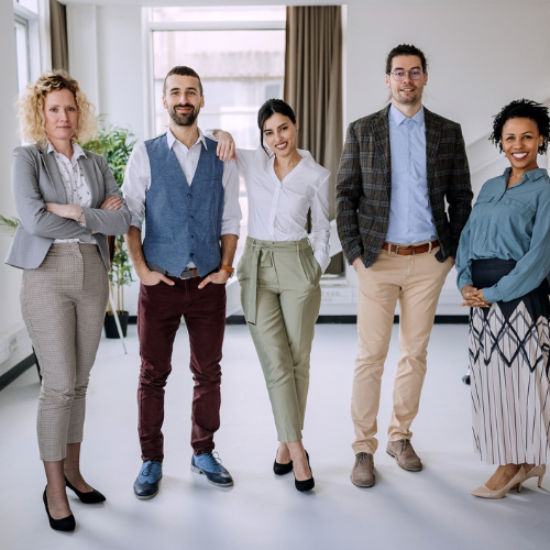 Associates posing in an office.
