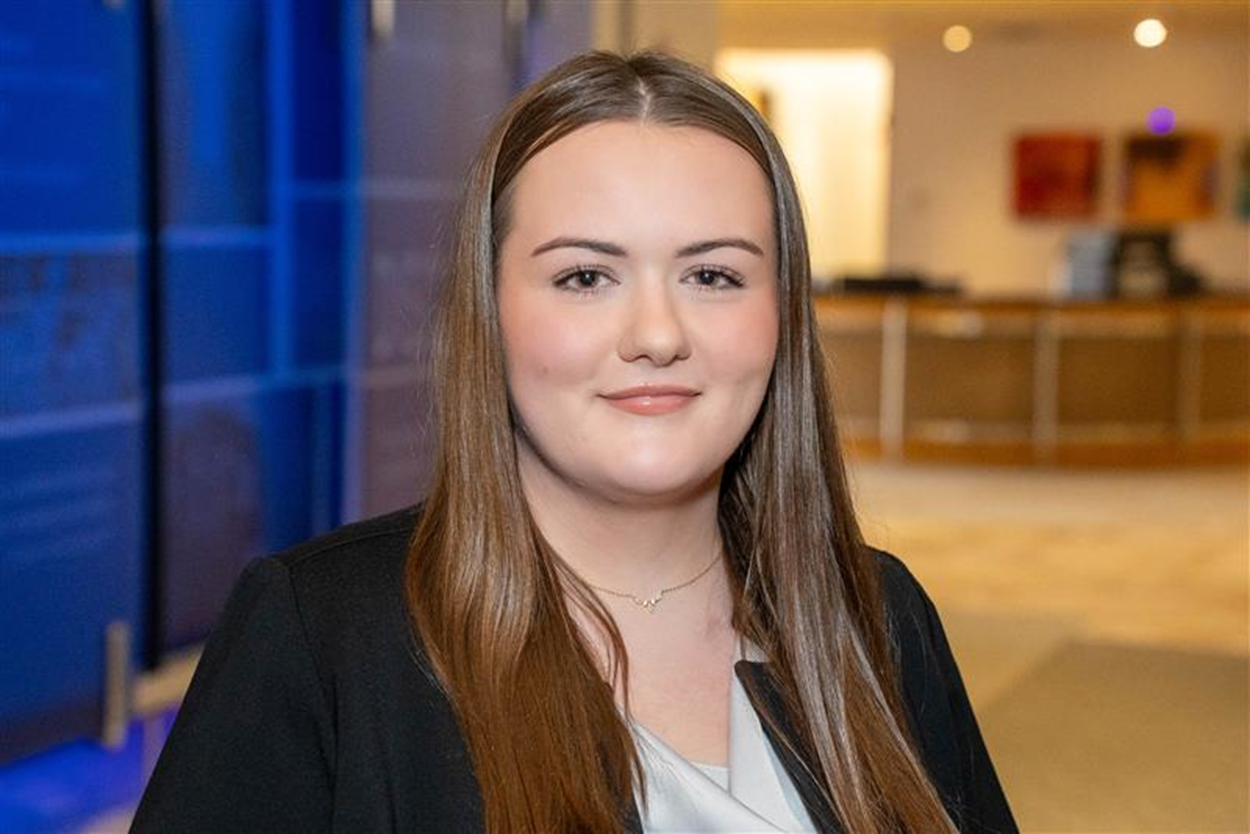 Headshot of a young woman with brown hair.