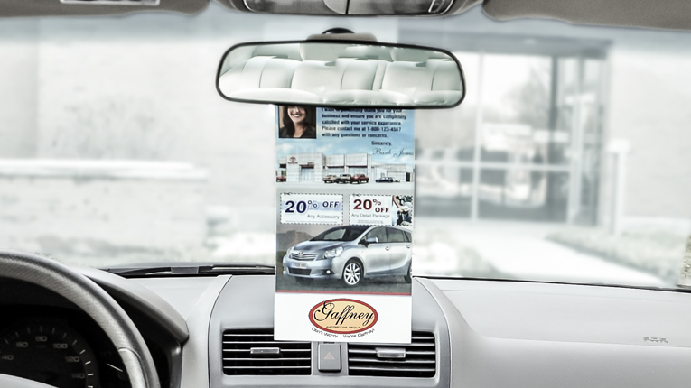 PromoTAG hanging on a rear-view mirror.